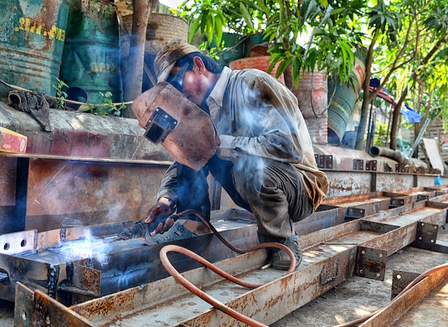 A contract employee doing wielding job